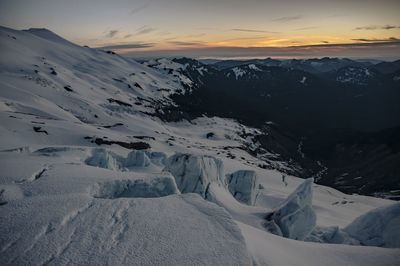 Scenic view of mountains against sky during winter