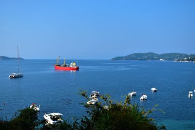 Scenic view of sea against clear blue sky