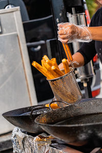Midsection of man preparing food in kitchen