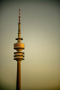 Low angle view of communications tower against sky