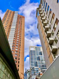 Low angle view of modern buildings against sky