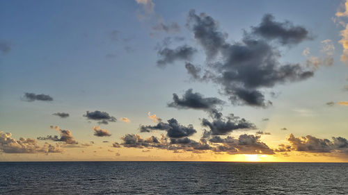 Scenic view of sea against sky at sunset