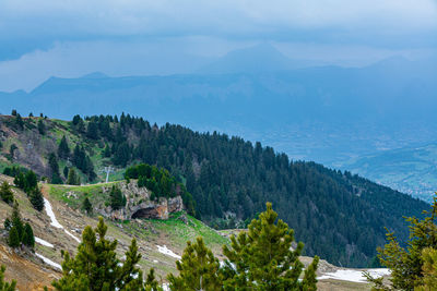 High angle view of trees and mountains against sky