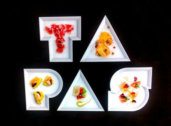 High angle view of food on table against black background