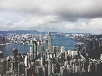 High angle view of cityscape against cloudy sky