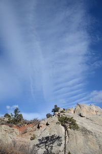 Low angle view of rocks against sky