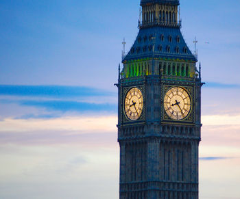 Low angle view of big ben against cloudy sky