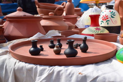 Close-up of small vases on table for sale