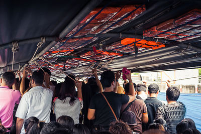 Rear view of people in corridor