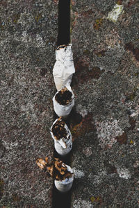 High angle view of cigarettes on field