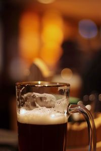 Close-up of beer glass on table