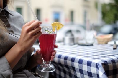 Close-up of hand holding drink