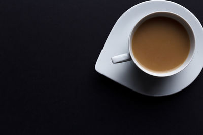 High angle view of coffee cup on table