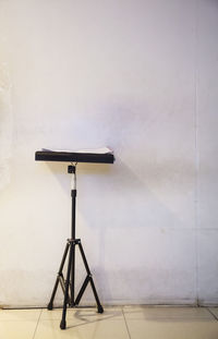 View of empty seat on table against wall