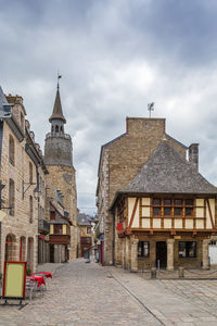 Street with half-timbered houses in dinan city center, brittany, france
