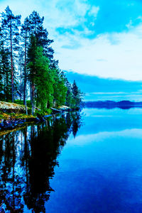 Reflection of clouds in calm lake