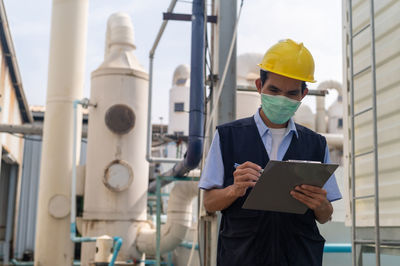 Portrait of engineer working in factory