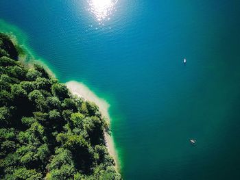 High angle view of sea against trees