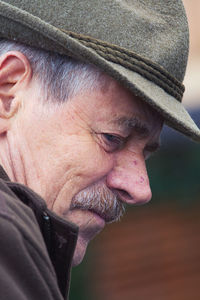 Close-up portrait of man wearing hat