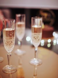 Close-up of wine glasses on table