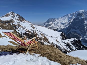 Snow covered mountain against sky, sundeck in the foreground