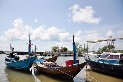 Boats moored in canal