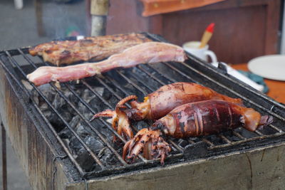 Close-up of meat on barbecue grill