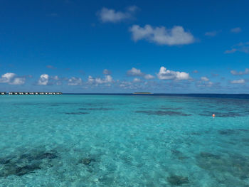 White sand and turquoise waters on the indian ocean beach in the maldives