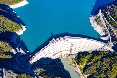 High angle view of buildings against blue sky