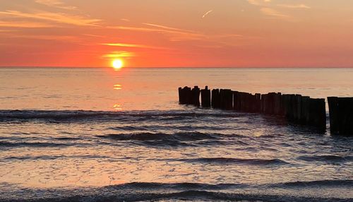 Scenic view of sea against sky during sunset