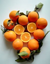 Close-up of oranges against white background