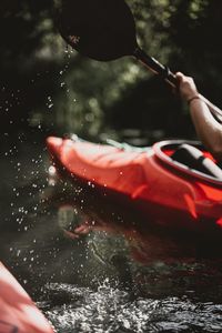 Cropped image of person kayaking in river