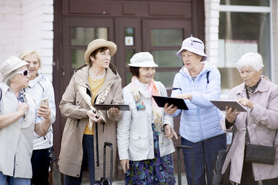 Group of people standing in front of building