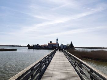 Pier over sea against sky