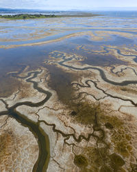 High angle view of wet sand on beach