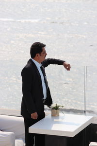 Businessman standing in restaurant