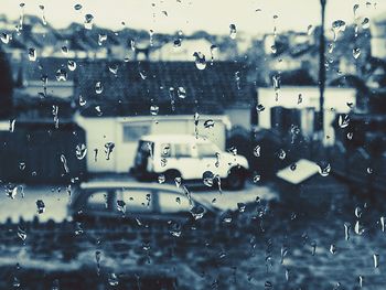 Full frame shot of wet glass window in rainy season