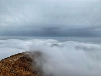 Scenic view of cloudscape over mountain