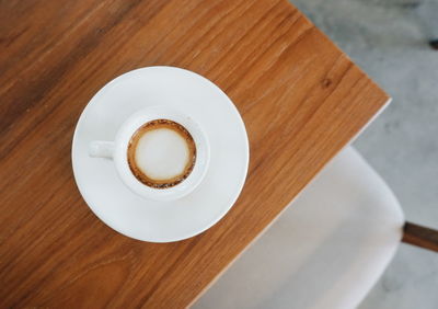 High angle view of coffee cup on table