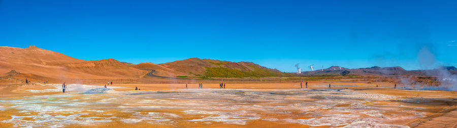 Scenic view of landscape against clear blue sky