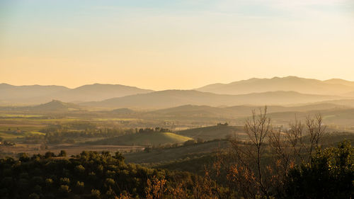 Scenic view of landscape against sky during sunset