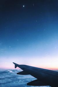 Airplane flying in sky at night