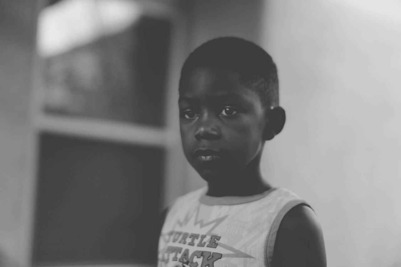 CLOSE-UP PORTRAIT OF BOY WEARING SUNGLASSES