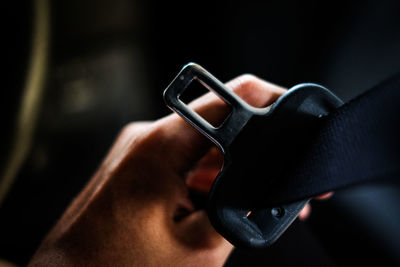 Close-up of hand holding eyeglasses