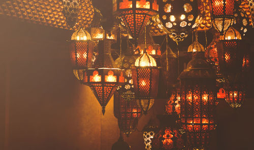 Close-up of illuminated lamp in restaurant