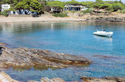 Sailboats moored on sea