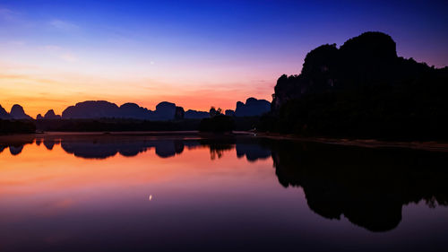 Nong thale lake and silhouette karst mountain at dawn with twilight sky, krabi