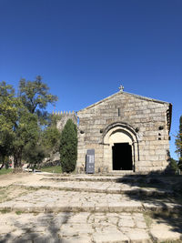 View of historic building against clear blue sky