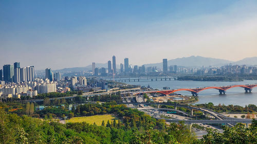 Bridge over river with buildings in background