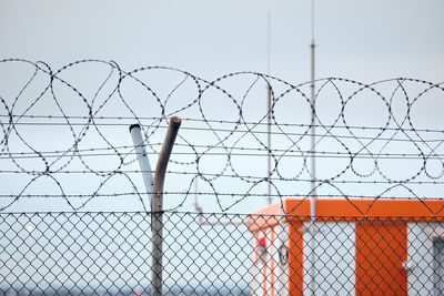 Close-up of chainlink fence against clear sky